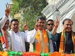 Tripura chief minister Manik Saha with Assam chief minister Himanta Biswa Sarma and BJP national spokesperson Sambit Patra show a victory sign during the roadshow in Agartala on Monday. (ANI) Tripura chief minister Manik Saha with Assam chief minister Himanta Biswa Sarma and BJP national spokesperson Sambit Patra show a victory sign during the roadshow in Agartala on Monday. (ANI)