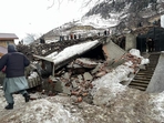 Landslide in the Rezan area of Kashmir's Ganderbal district damaged at least 10 residential buildings.(Waseem Andrabi/HT Photo)