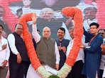 Union Home Minister Amit Shah with Maharashtra Deputy Chief Minister Devendra Fadnavis being garlanded during the Vijay Sankalp Mela, in Kolhapur on Sunday. (ANI) Union Home Minister Amit Shah with Maharashtra Deputy Chief Minister Devendra Fadnavis being garlanded during the Vijay Sankalp Mela, in Kolhapur on Sunday. (ANI)