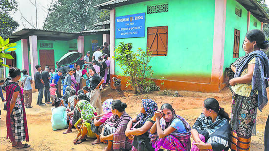 People stand in a queue outside a polling booth in Meghalaya’s Ri Bhoi district on Monday. (PTI) People stand in a queue outside a polling booth in Meghalaya’s Ri Bhoi district on Monday. (PTI)