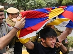 A protestor with Tibetan flag being shoved away by the police. (Vipin Kumar/ Hindustan Times) A protestor with Tibetan flag being shoved away by the police. (Vipin Kumar/ Hindustan Times)