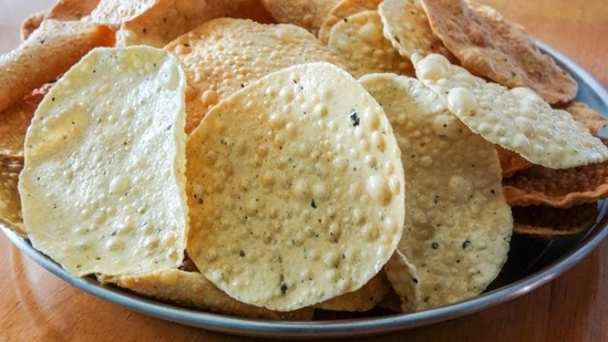 Roasted Papad: Papads can be roasted in the microwave or on a skillet for a healthy snack. You can sprinkle some chaat masala or cumin powder for flavour. (Shutterstock)