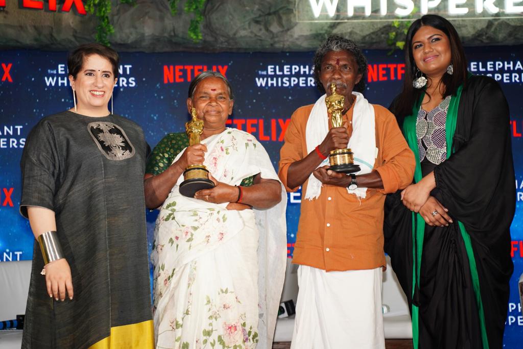 Guneet Monga and Kartiki Gonsalves with the subjects of the Oscar-winning documentary, Bomman and Bellie. Guneet Monga and Kartiki Gonsalves with the subjects of the Oscar-winning documentary, Bomman and Bellie.