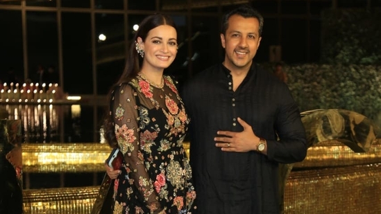 Dia Mirza and husband Vaibhav Rekhi were twinning in black at the nmacc event. Dia was in an embroidered gown and added a quirky ear accessory. (Varinder Chawla)