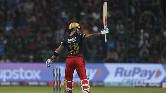 Virat Kohli celebrates after scoring fifty during the Indian Premier League match between Royal Challengers Bangalore and Mumbai Indians in Bengaluru(AP)