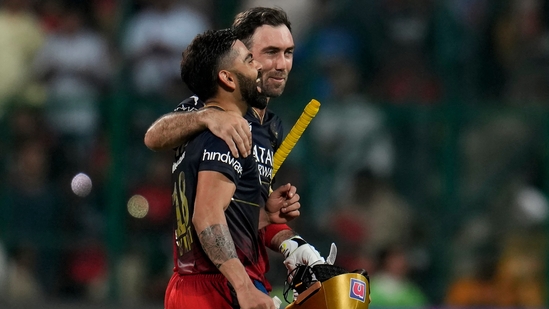 Virat Kohli celebrates with Glenn Maxwell as they leave the field after Royal Challengers Bangalore's win in Indian Premier League match against Mumbai Indians(AP)