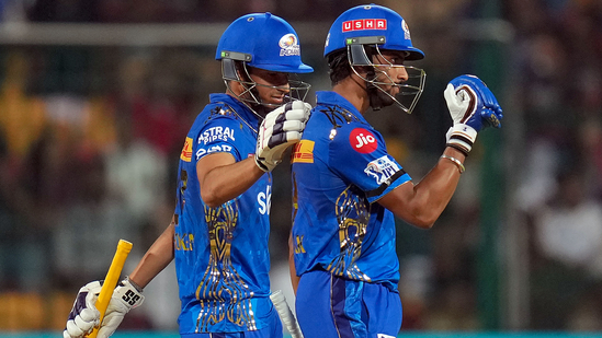 Mumbai Indians batter Tilak Varma celebrates his fifty during IPL 2023 match against Royal Challengers Bangalore(PTI)