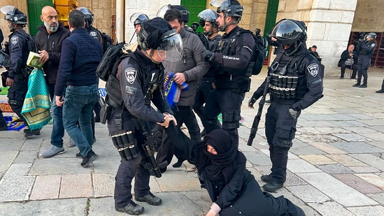 Israeli police raided Al-Aqsa mosque in Jerusalem's Old City early Wednesday and attacked Palestinian worshippers, who hurled firecrackers at them in a burst of violence during a sensitive holiday season.(AFP)