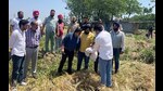 Officials from Administration interacting with farmers to collect information of damaged crop in Ludhiana on Saturday. (HT Photo) Officials from Administration interacting with farmers to collect information of damaged crop in Ludhiana on Saturday. (HT Photo)