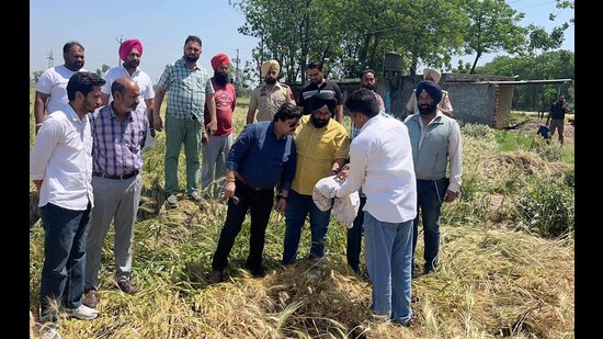 Officials from Administration interacting with farmers to collect information of damaged crop in Ludhiana on Saturday. (HT Photo) Officials from Administration interacting with farmers to collect information of damaged crop in Ludhiana on Saturday. (HT Photo)