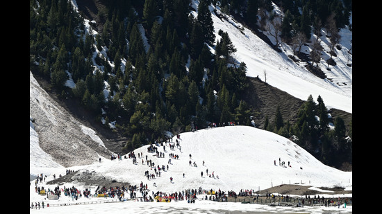 Tourists enjoying the snow-covered slopes in Sonamarg on Sunday. The day temperature has climbed above normal substantially as the weather continues to improve in Jammu and Kashmir with fair weather prediction by MeT on Sunday for the next eight days. (Waseem Andrabi/HT) Tourists enjoying the snow-covered slopes in Sonamarg on Sunday. The day temperature has climbed above normal substantially as the weather continues to improve in Jammu and Kashmir with fair weather prediction by MeT on Sunday for the next eight days. (Waseem Andrabi/HT)