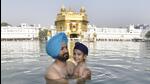 A young devotee taking a dip in the sarovar at Golden Temple, Amritsar, on the occasion of Baisakhi, (Sameer Sehgal/HT) A young devotee taking a dip in the sarovar at Golden Temple, Amritsar, on the occasion of Baisakhi, (Sameer Sehgal/HT)