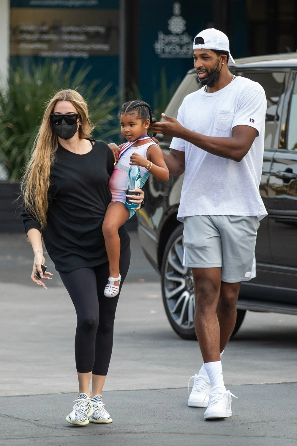 Khloé Kardashian and Tristan Thompson with daughter True. Khloé Kardashian and Tristan Thompson with daughter True.