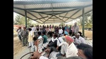 Mandi workers (labourers) during a strike in Sangrur on Monday. (HT Photo) Mandi workers (labourers) during a strike in Sangrur on Monday. (HT Photo)