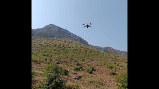 Strict monitoring of the forests atop the Vyohargiri hills is also being conducted by drone cameras, district administration officials said. (Santosh Kumar/HT Photo)