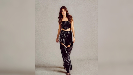 The black leather corset top is worth <span class='webrupee'>₹</span>9,490 and her matching wide pants are for <span class='webrupee'>₹</span>13,490. (Instagram/@rhea_chakraborty)