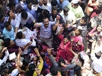 NCP workers celebrate outside party office in Mumbai after committee's decision rejecting Pawar's resignation.   (Anshuman Poyrekar/ Hindustan Times)