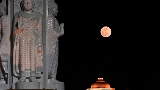 The full moon as seen on a penumbral lunar eclipse day. A penumbral lunar eclipse occurs when the moon enters the Earth's penumbra, the outer part of the shadow. The lunar eclipse started at 8:59 PM (Local Time) on Friday and will continue till 1:16 AM (Local Time) Saturday.(HT Photo/Deepak Gupta)