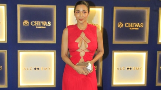 Malaika Arora made an appearance wearing a red gown with crisscross detailing.