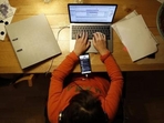 In workplaces that have moved to hybrid work, there are still plenty of open questions. (Bloomberg file photo) In workplaces that have moved to hybrid work, there are still plenty of open questions. (Bloomberg file photo)