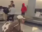 Video of wild brawl over baggage claim at Chicago's O'Hare airport goes viral Video of wild brawl over baggage claim at Chicago's O'Hare airport goes viral