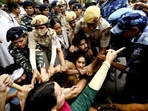 Ace wrestlers Vinesh Phogat, Sakshi Mallik and Bajrang Punia were among others who were detained by Delhi Police on Sunday while attempting to march to the new Parliament building where they planned to stage a demonstration.(Sanjeev Verma/ Hindustan Times) Ace wrestlers Vinesh Phogat, Sakshi Mallik and Bajrang Punia were among others who were detained by Delhi Police on Sunday while attempting to march to the new Parliament building where they planned to stage a demonstration.(Sanjeev Verma/ Hindustan Times)