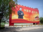 Chinese President Xi Jinping is seen on a billboard reading Chinese President Xi Jinping is seen on a billboard reading