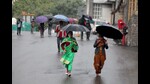 People walk with umbrellas during rain in Shimla on Wednesday. Winter-like chill gripped Himachal. (Deepak Sansta /HT) People walk with umbrellas during rain in Shimla on Wednesday. Winter-like chill gripped Himachal. (Deepak Sansta /HT)