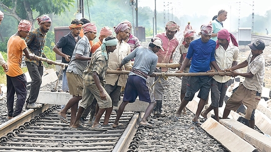 Workers restore railway tracks at the site of collision in Odisha’s Balasore district on Tuesday. (PTI) Workers restore railway tracks at the site of collision in Odisha’s Balasore district on Tuesday. (PTI)