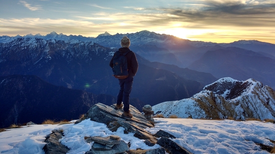Chopta, Uttarakhand: Often referred to as the "Mini Switzerland of India," Chopta is a picturesque hill station tucked away in Uttarakhand. Surrounded by dense forests and towering peaks, including the majestic Nanda Devi and Chaukhamba, Chopta offers a peaceful atmosphere and serves as the base for the popular trek to Tungnath, the highest Shiva temple in the world.(Unsplash)