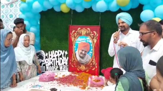 Sidhu Moose Wala’s parents at a function to mark 30th birthday of the slain singer, at Moosa village in Mansa on Sunday. (HT File) Sidhu Moose Wala’s parents at a function to mark 30th birthday of the slain singer, at Moosa village in Mansa on Sunday. (HT File)