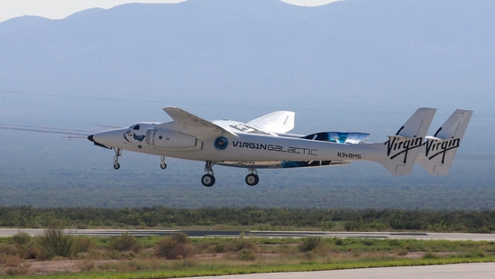 Virgin Galactic's passenger rocket plane VSS Unity, borne by twin-fuselage carrier jet dubbed VMS Eve. (Reuters)