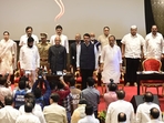 Newly appointed ministers during the national anthem after the oath-taking ceremony at Raj Bhavan on Sunday.(HT Photo/Anshuman poyrekar) Newly appointed ministers during the national anthem after the oath-taking ceremony at Raj Bhavan on Sunday.(HT Photo/Anshuman poyrekar)