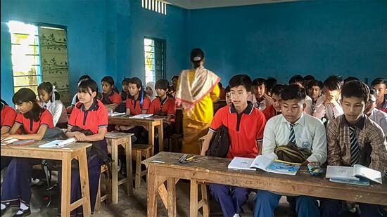 Students attend a class at a school that reopened after remaining shut for months because of ethnic clashes in Manipur (PTI) Students attend a class at a school that reopened after remaining shut for months because of ethnic clashes in Manipur (PTI)
