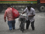 Commuters pass through a heavily waterlogged stretch of road, at Sector 62, in Noida,(Sunil Ghosh/ Hindustan Times) Commuters pass through a heavily waterlogged stretch of road, at Sector 62, in Noida,(Sunil Ghosh/ Hindustan Times)
