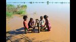 Children fetch drinking water from a hand-pump in a flood-affected area after a breach in river Sutlej following heavy monsoon rains in Jalandhar district. (AFP) Children fetch drinking water from a hand-pump in a flood-affected area after a breach in river Sutlej following heavy monsoon rains in Jalandhar district. (AFP)