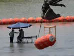 Texas’ large orange barriers in the Rio Grande have drawn the ire of the Mexican government. Texas’ large orange barriers in the Rio Grande have drawn the ire of the Mexican government.