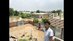 Balvir Singh shows his house submerged in floodwater. Balvir Singh shows his house submerged in floodwater.