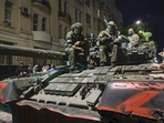 Membes of the Wagner Group military company sit atop of a tank on a street in Rostov-on-Don. (AP) Membes of the Wagner Group military company sit atop of a tank on a street in Rostov-on-Don. (AP)