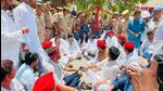 SP delegation members and supporters during a sit-in near the gates of the Naini Central Jail on Thursday (HT Photo) SP delegation members and supporters during a sit-in near the gates of the Naini Central Jail on Thursday (HT Photo)