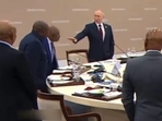 Russian President Vladimir Putin urging Comoros President to keep sitting after a protocol breach during an official meet. (Twitter) Russian President Vladimir Putin urging Comoros President to keep sitting after a protocol breach during an official meet. (Twitter)