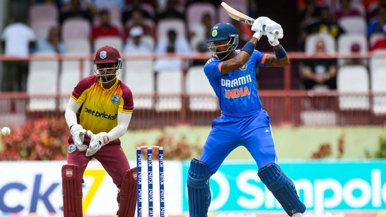 Hardik Pandya hits four as Nicholas Pooran looks on during the 2nd T20I between West Indies and India(AFP)