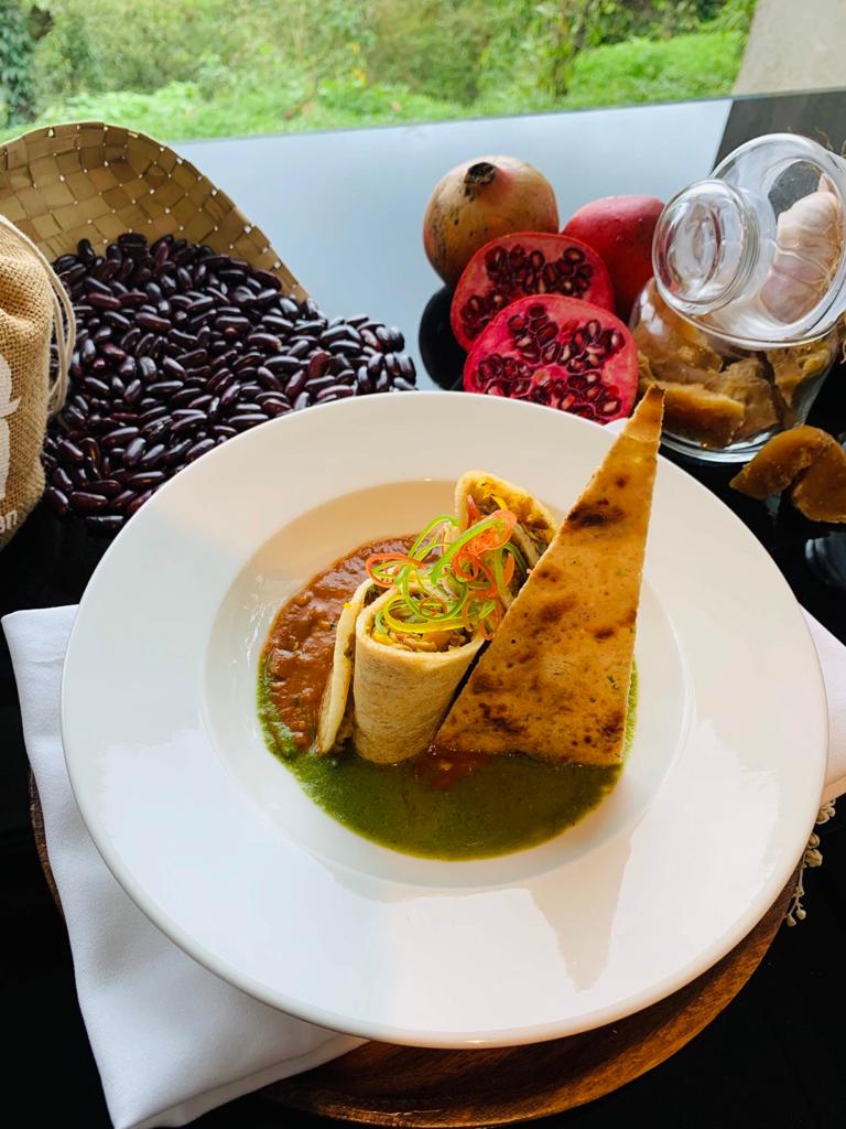 A fusion dish combining soft chawal crepes filled with paneer and paired with flavorful rajma curry, served alongside green chutney and a papad crisp for a delightful meal.(Chef Abhishek Kulshrestha) A fusion dish combining soft chawal crepes filled with paneer and paired with flavorful rajma curry, served alongside green chutney and a papad crisp for a delightful meal.(Chef Abhishek Kulshrestha)
