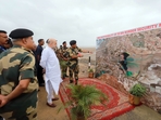 Home Minister Amit Shah with BSF commanders on the Indo-Pak border in Kutch on August 12. Home Minister Amit Shah with BSF commanders on the Indo-Pak border in Kutch on August 12.