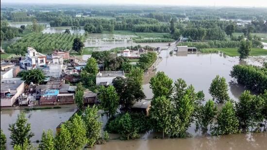 An aerial view of a flooded village in Ropar district on Wednesday after floodgates at Bhakra Dam were opened two days ago. (ANI Photo) An aerial view of a flooded village in Ropar district on Wednesday after floodgates at Bhakra Dam were opened two days ago. (ANI Photo)