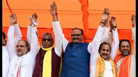 Deputy CM Brajesh Pathak flanked by SBSP chief OP Rajbhar (L) and BJP candidate Dara Singh Chauhan (R) and others at a public meeting in Ghosi. (Sourced) Deputy CM Brajesh Pathak flanked by SBSP chief OP Rajbhar (L) and BJP candidate Dara Singh Chauhan (R) and others at a public meeting in Ghosi. (Sourced)