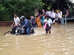 Severe waterlogging forced commuters on Saturday morning to walk through muddy waters. (Photo by Parveen Kumar/Hindustan Times) Severe waterlogging forced commuters on Saturday morning to walk through muddy waters. (Photo by Parveen Kumar/Hindustan Times)