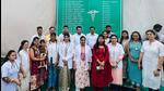 The doctors of Gharivali pose before a hoarding with all their names, which is prominently displayed in the village. (HT Photo) The doctors of Gharivali pose before a hoarding with all their names, which is prominently displayed in the village. (HT Photo)