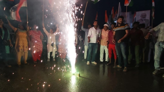 Bharatiya Janata Party workers light fireworks after successful landing of Chadryan-3 on moon (Hindustan Times)