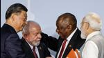 PM Modi and President Xi, who sat on either side of South African President Cyril Ramaphosa, also spoke briefly and shook hands at the conclusion of the news conference (AFP Photo) PM Modi and President Xi, who sat on either side of South African President Cyril Ramaphosa, also spoke briefly and shook hands at the conclusion of the news conference (AFP Photo)